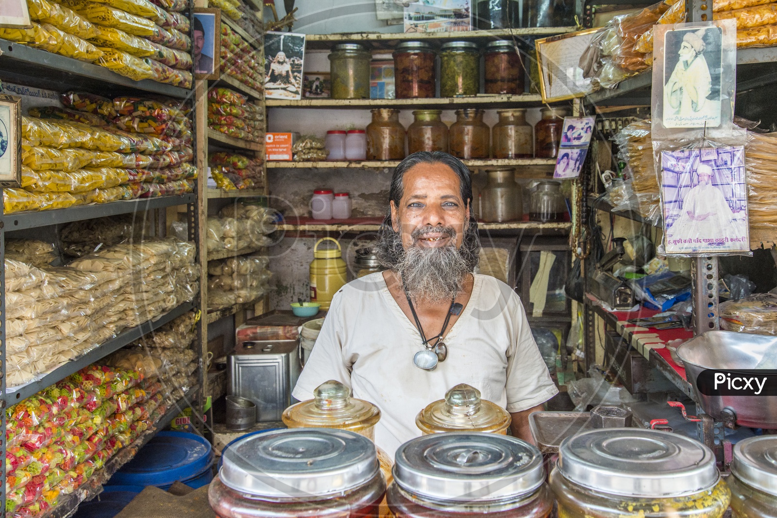 Happy Old Muslim Man in Shop