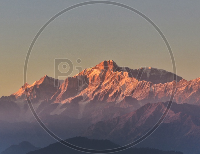 Sunset paints the Himalayas red, as seen from Tungnath