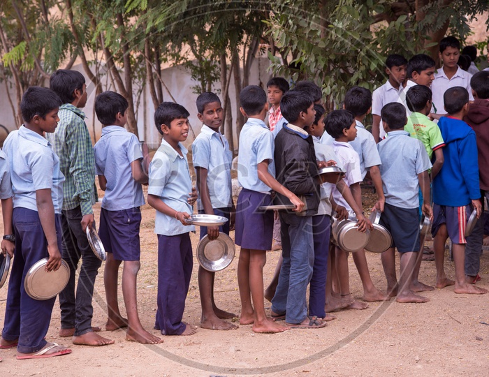 Students served Mid Day meals at a Govt School in Telangana