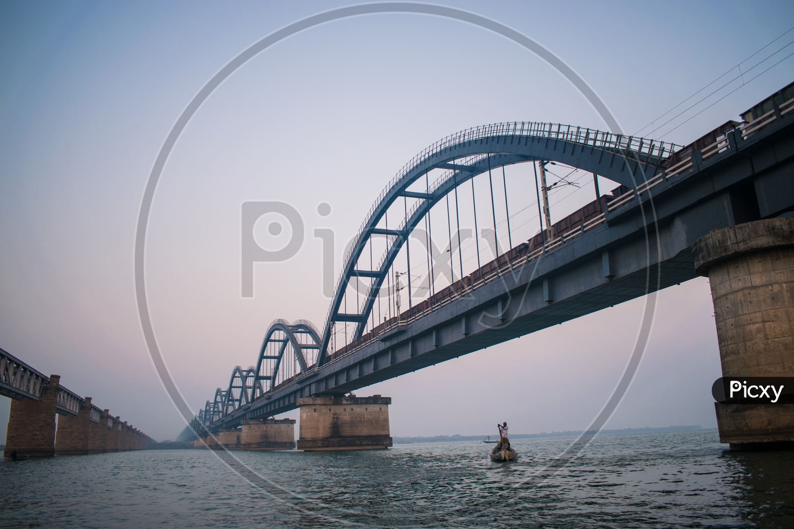 Godavari Arch Bridge and A Fisherman
