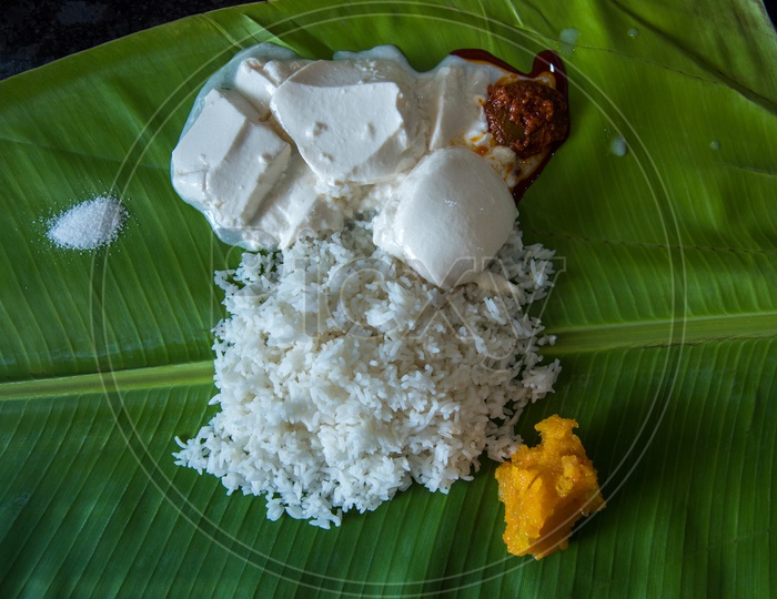 Salt, Curd, Mango Pickel and Sweet at Murugan Hotel