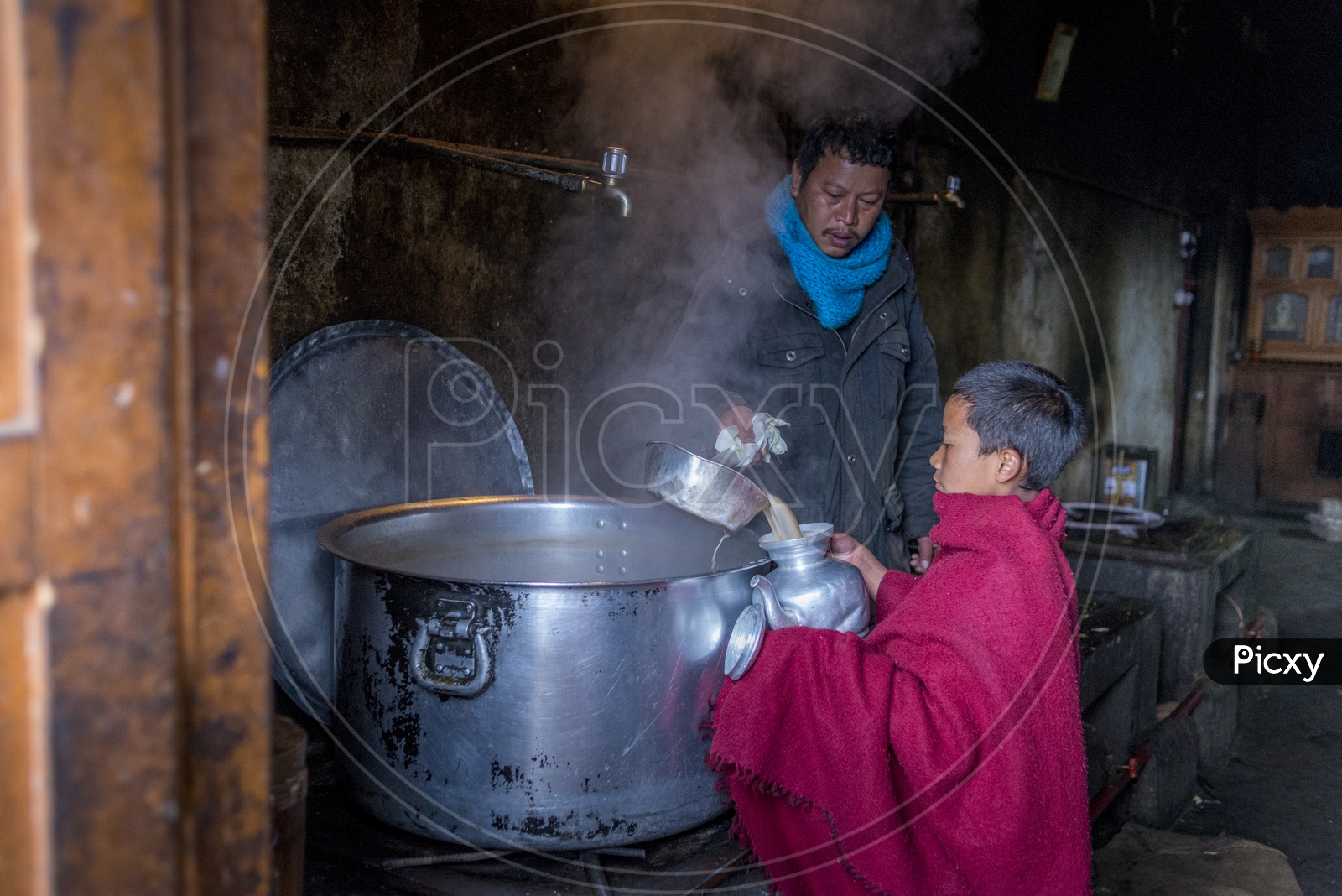 Giving tea to Buddhist Monk, Arunachal Pradesh