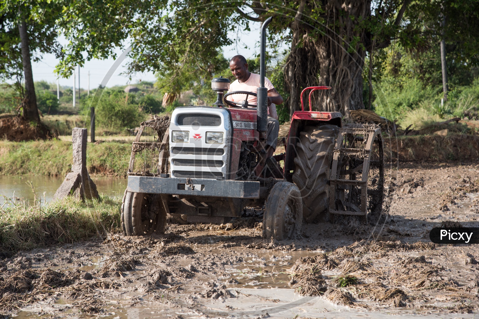 Ploughing fields with tractor at a farm in Telangana