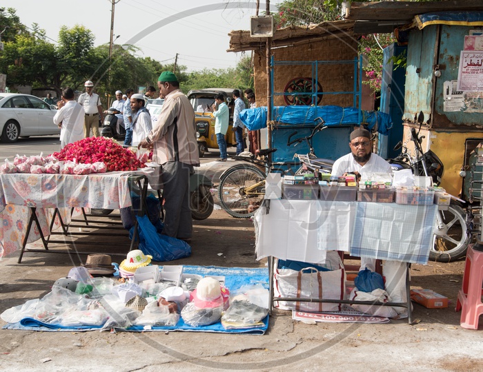Vendors selling flower, caps and attar during Eid