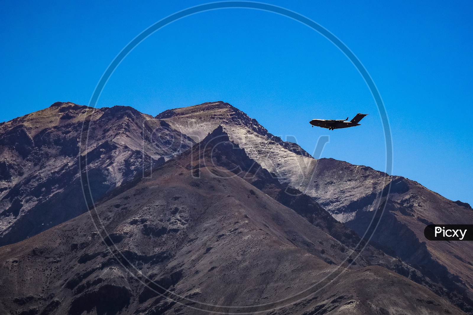 An aeroplane flying above the Hills and Mountains of Leh ladakh