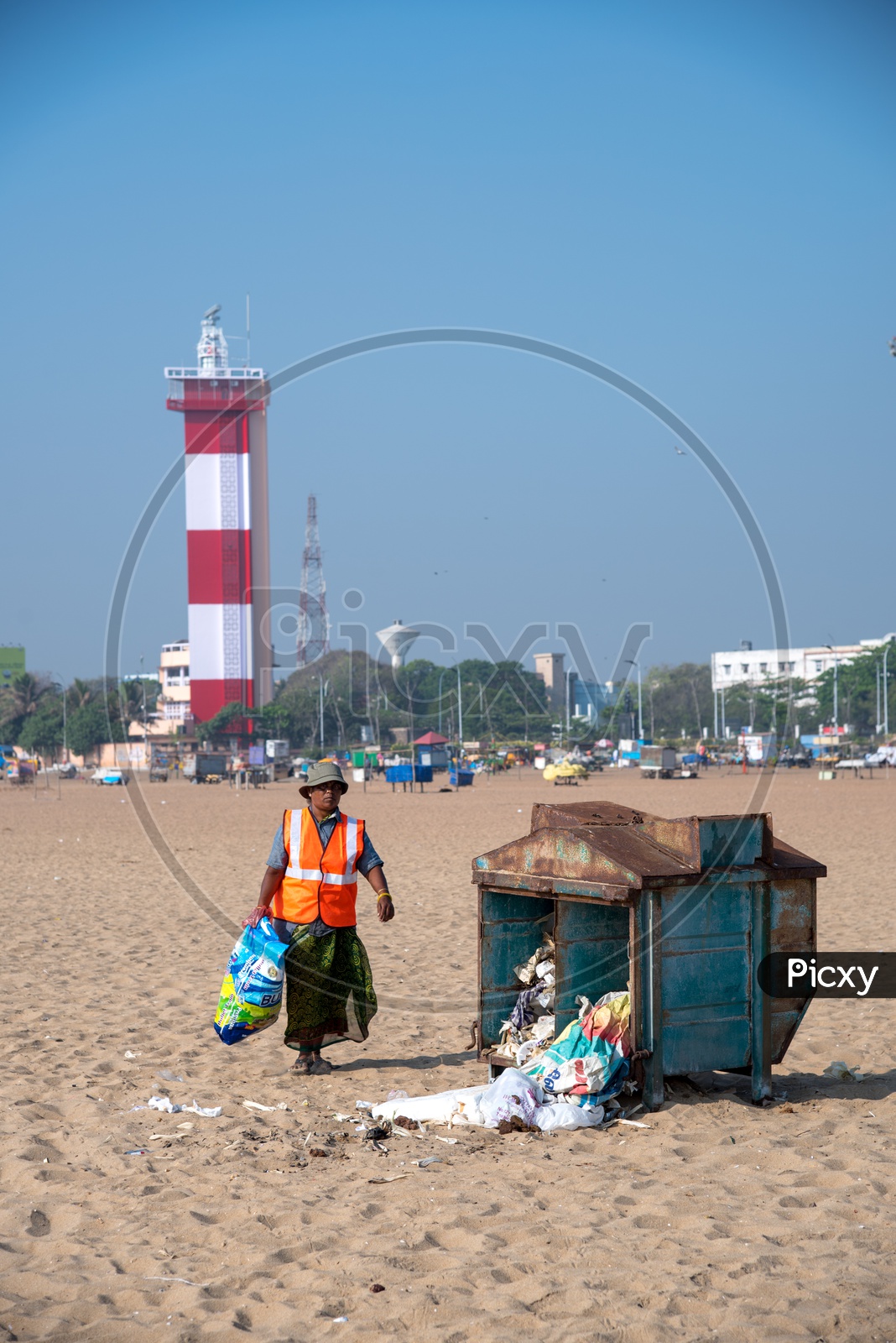 A muncipality worker cleaning off the beach