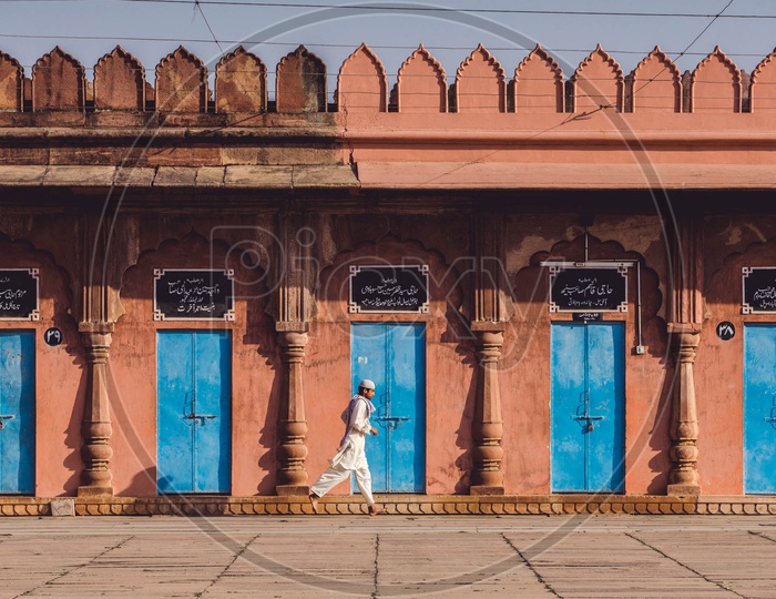 A boy jogging around at Taj Ul Masjid , Bhopal, Madhya Pradesh.