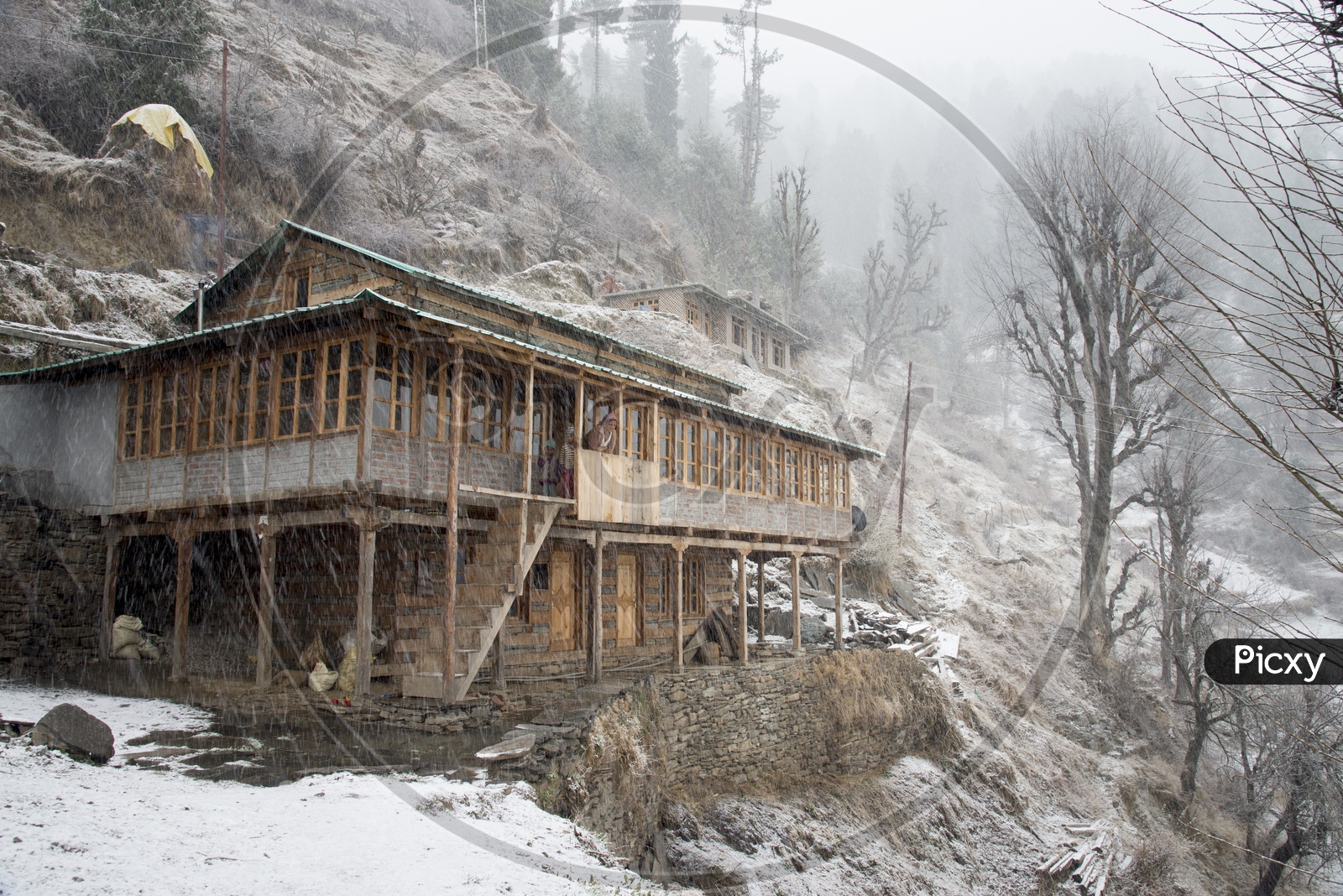 Snow Covered Houses at Jana Village near Manali