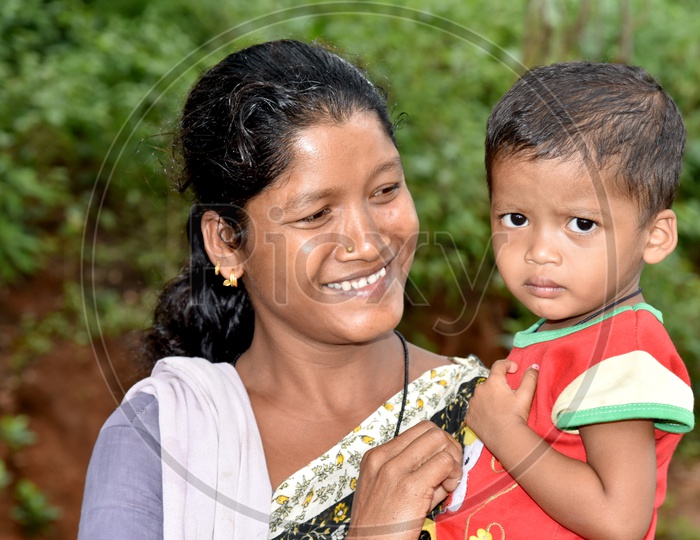 Smiling Tribal Woman with her Son