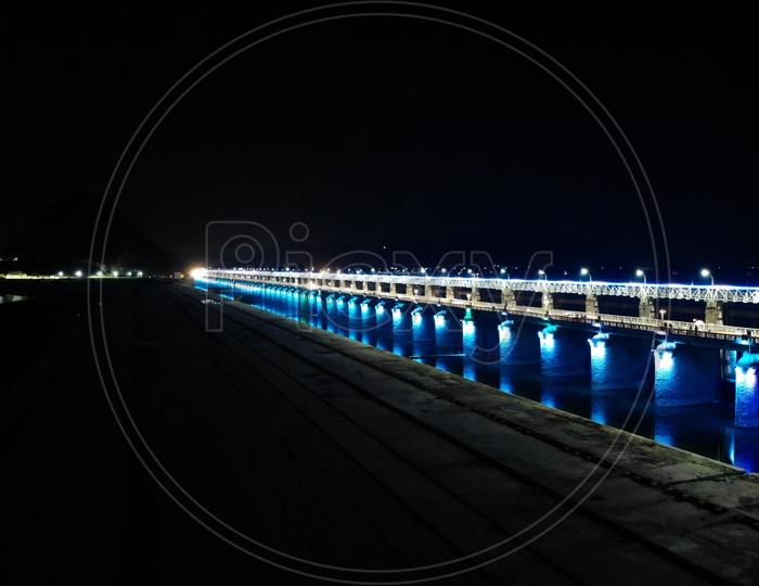 Prakasam Barrage being lit at night by programmed colors