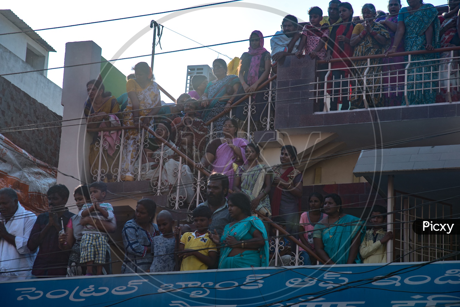 Pilgrims,Locals watchig the Panakala Laxmi Narasimha Swamy Temple Chariot rallying in the Streets of Mangalagiri