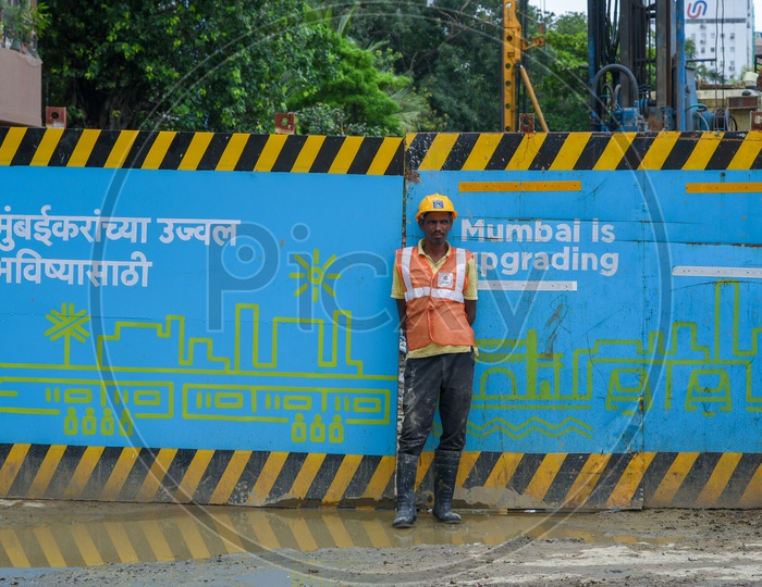A construction worker of the Mumbai Metro Rail at Churchgate