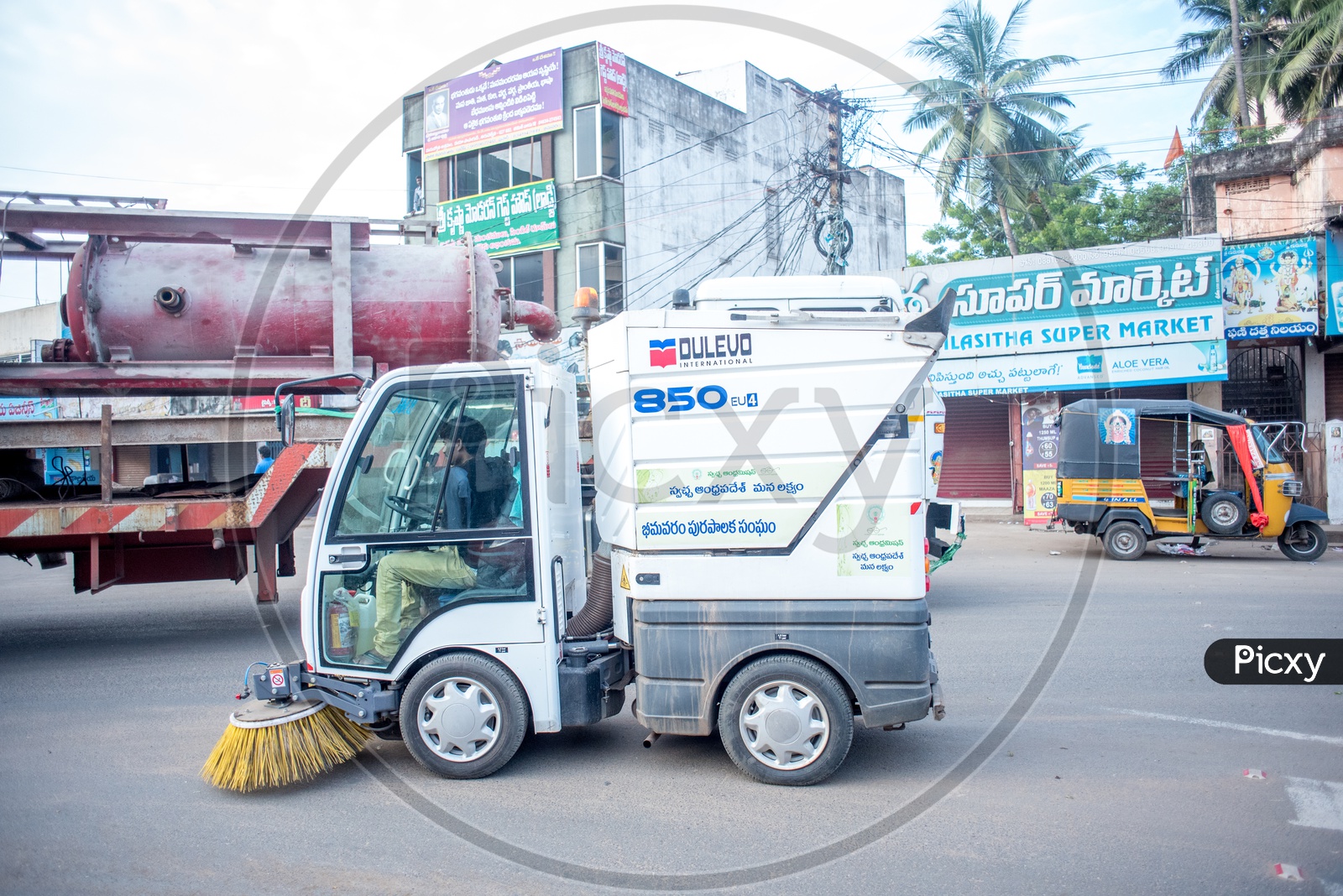 Bhimavaram municipal vehicle cleaning the roads
