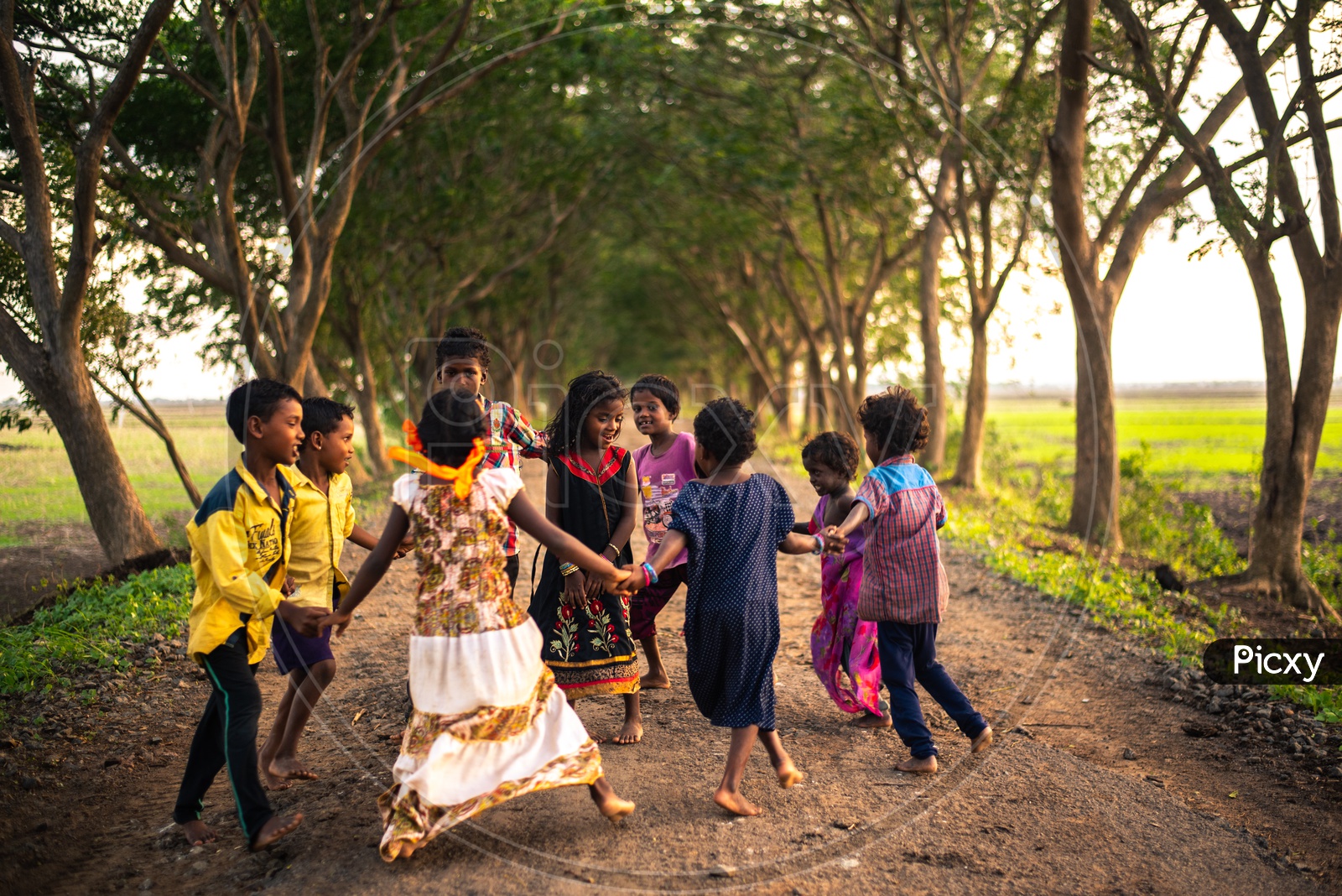 Kids playing on a road between Chiluvuru and Namburu
