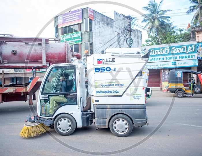 Bhimavaram municipal vehicle cleaning the roads