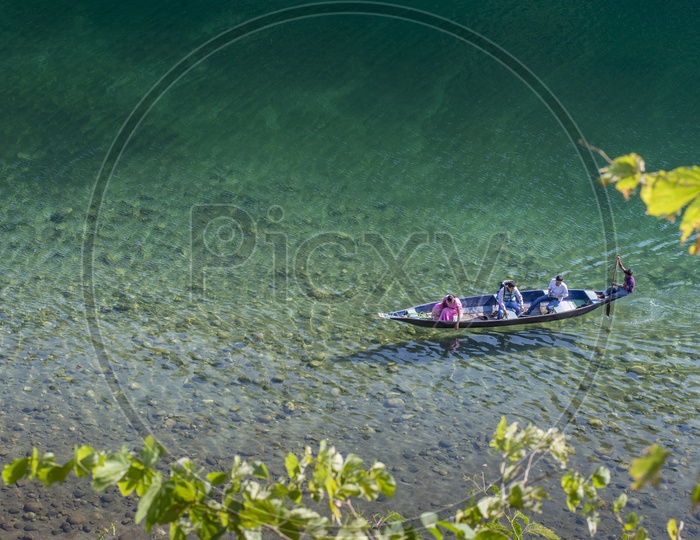 Tourist Boat in Crystal Clear Umngot river