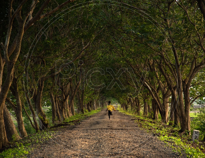 A kid Playing on a road between Chiluvuru and Namburu