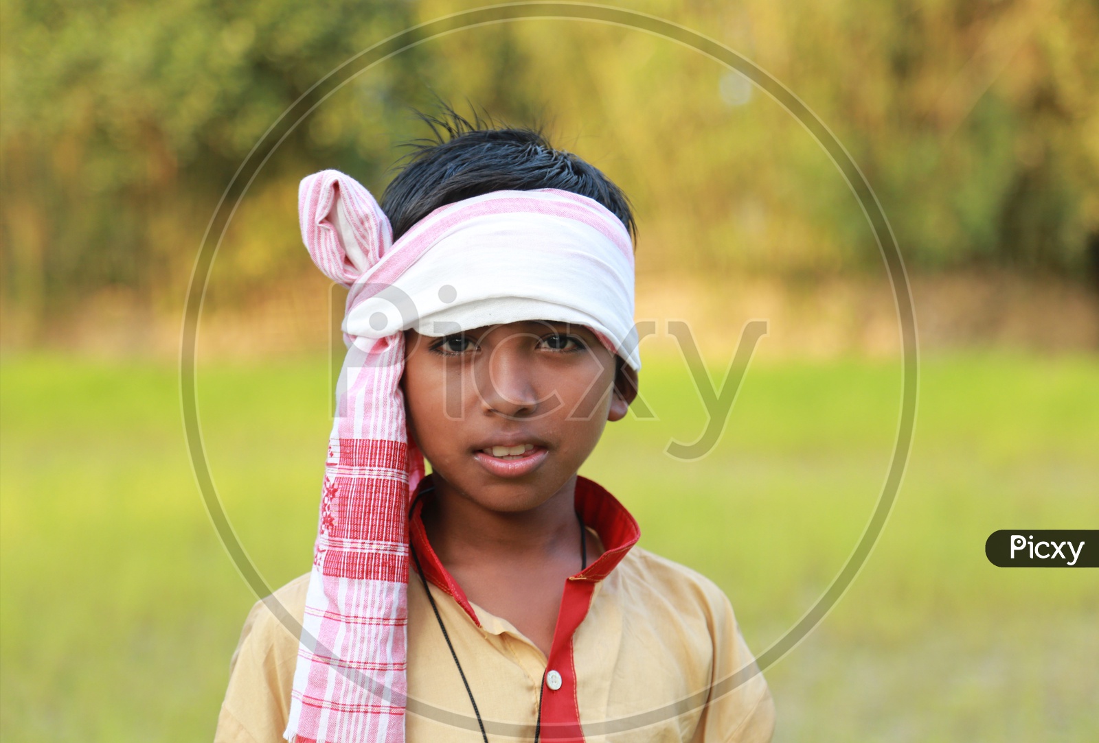 A boy in Bihu attire.