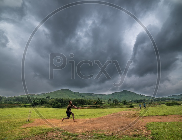 kids playing cricket in araku valley