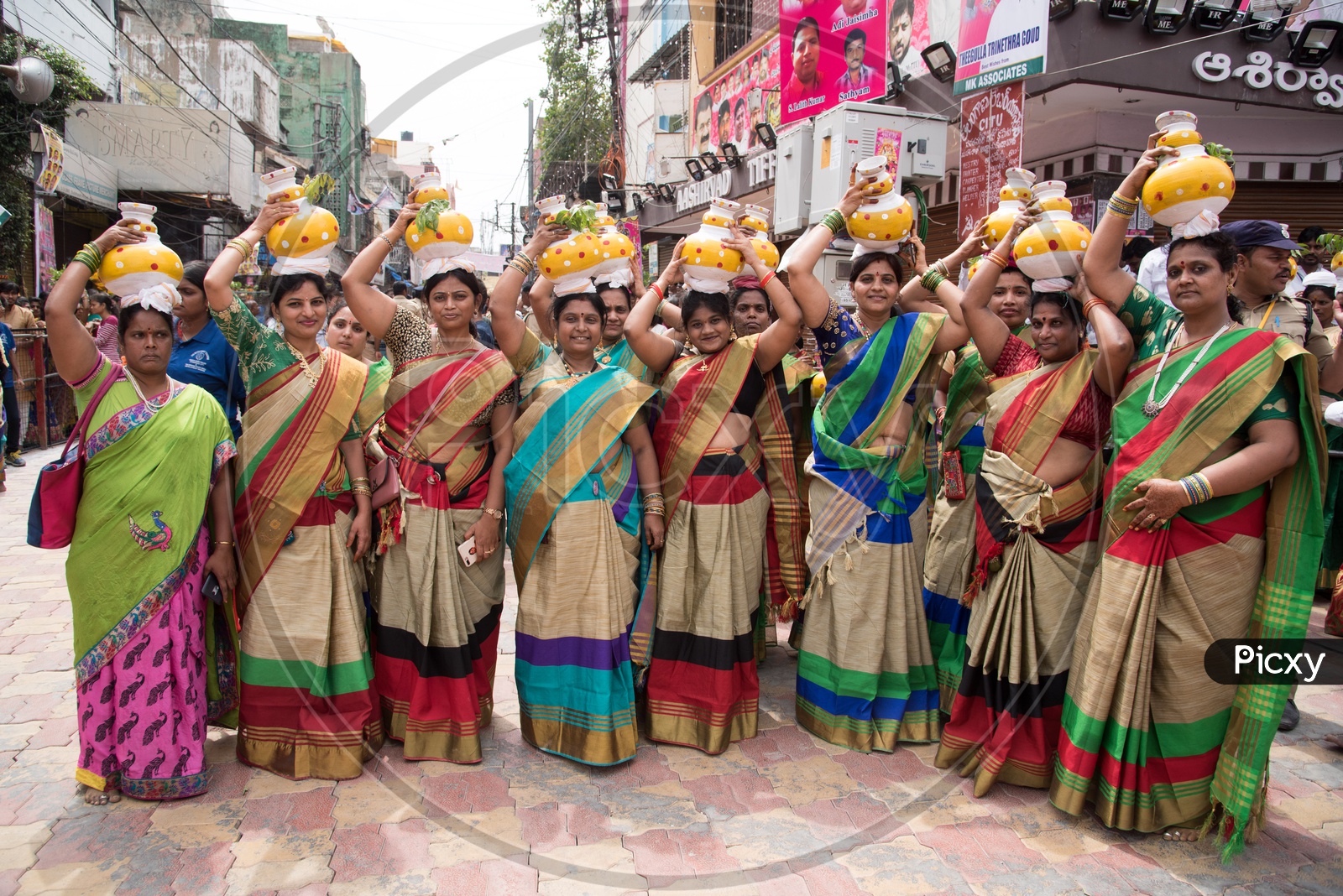 Women carrying Bonam pot as offerings to Goddess Mahankali during Bonalu Festival