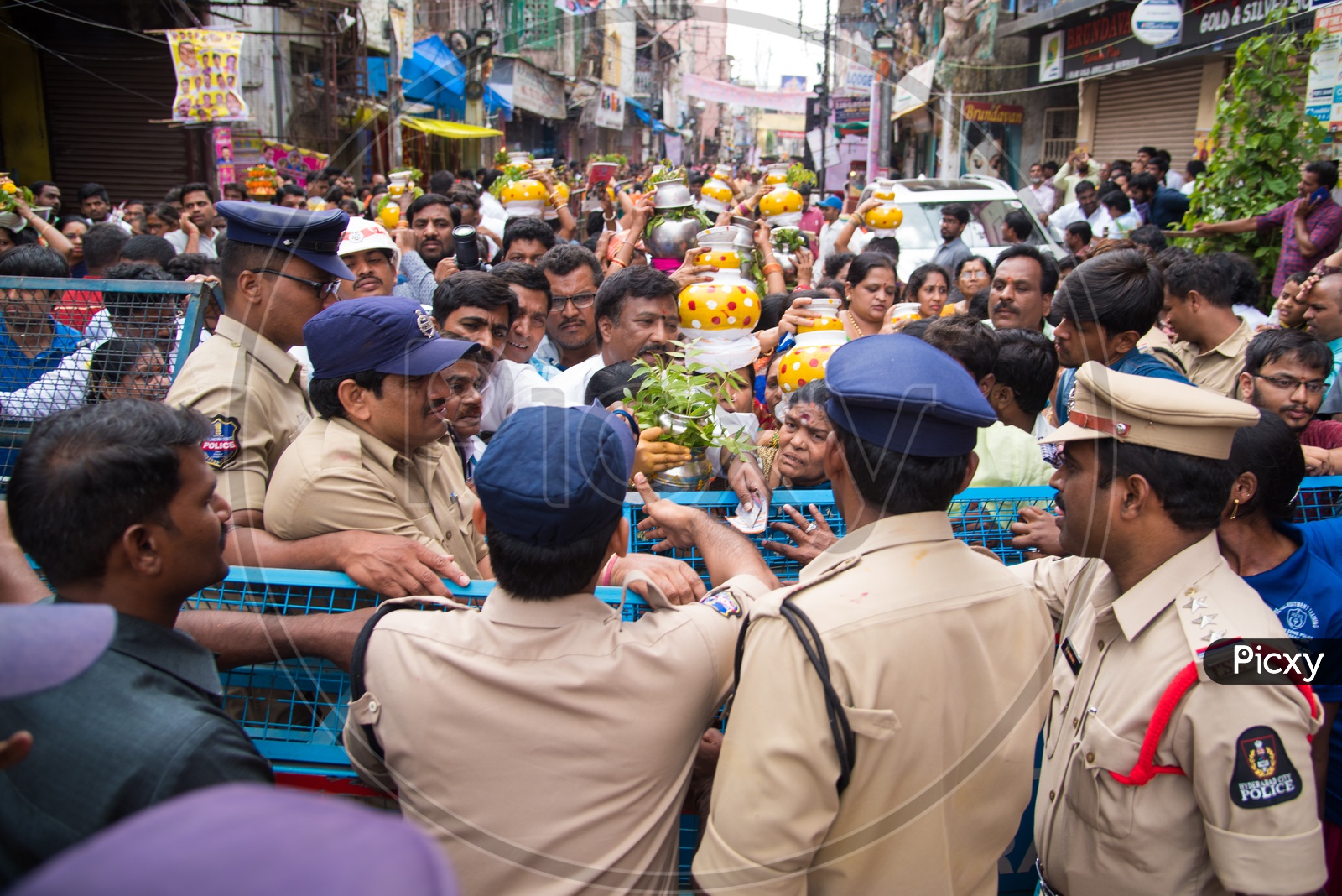Police controls crowd during Bonalu at Mahakali Temple