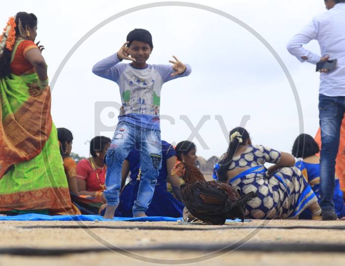 boy playing on Bonaalu celebration  in Hyderabad. bonaalu at Golconda fort