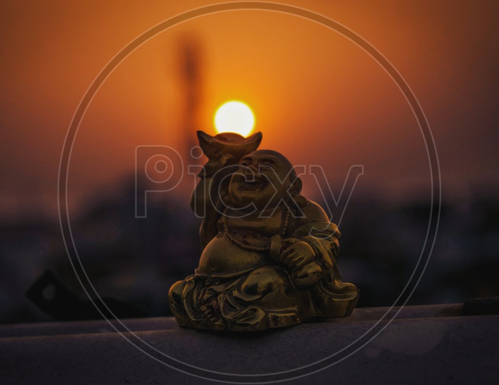 Buddha lifting sun