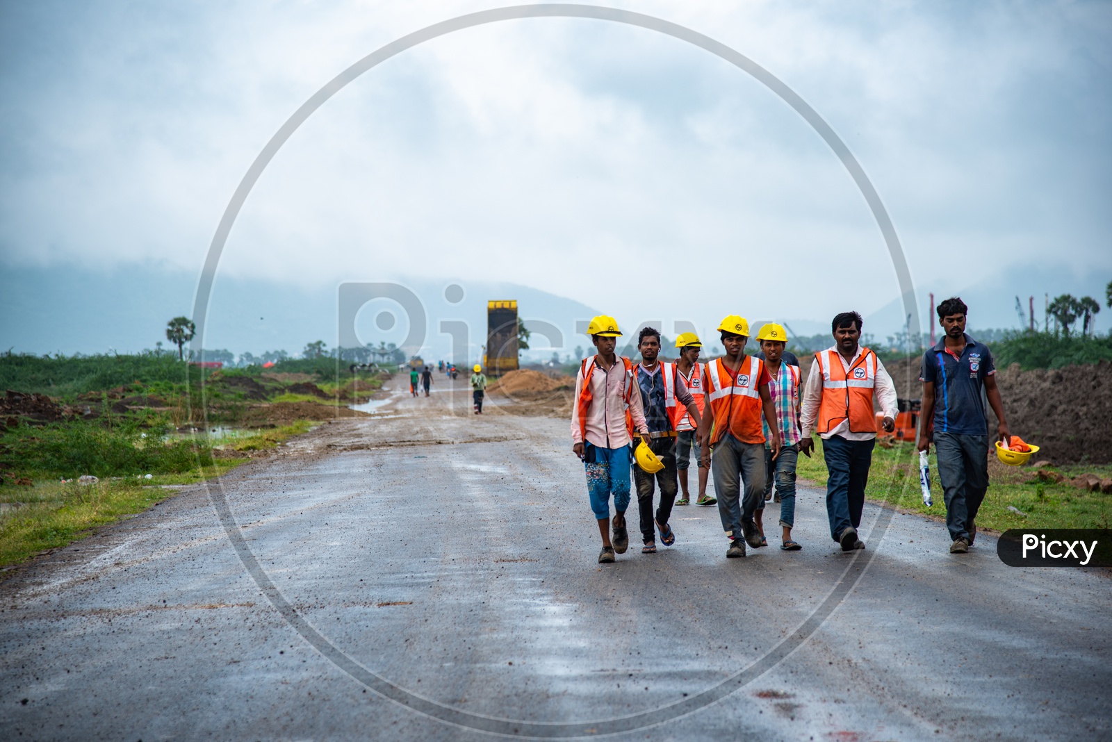 L & T workers signing off after a heavy rain as they works got halted