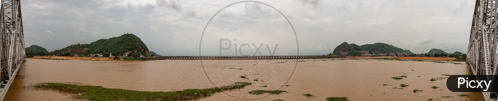 RZiver Krishna Water gushing out of Prakasam Barrage as the gates have been lifted off to release water into the sea
