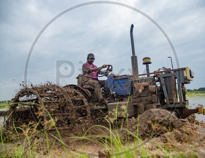 A farmer ploughing with a tractor