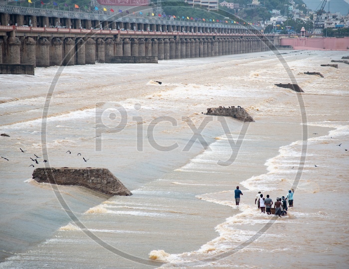 fishing at Prakasam Barrage as the water is released in to the sea