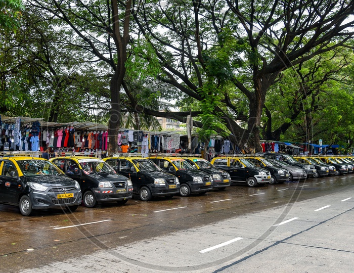 Taxis parked on a street in Mumbai