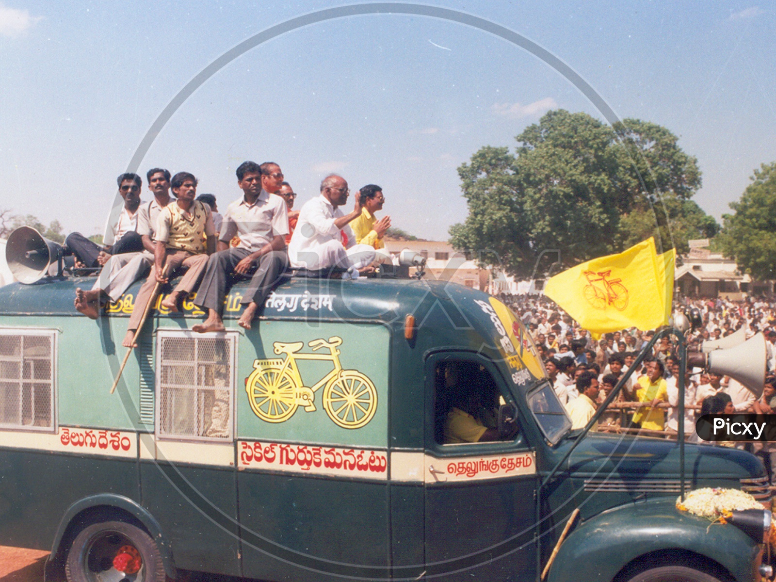 N T Rama Rao ( NTR ) arriving at a political rally on Telugu Desam Party Election Campaign Vehicle along with Mr. Madhavareddy