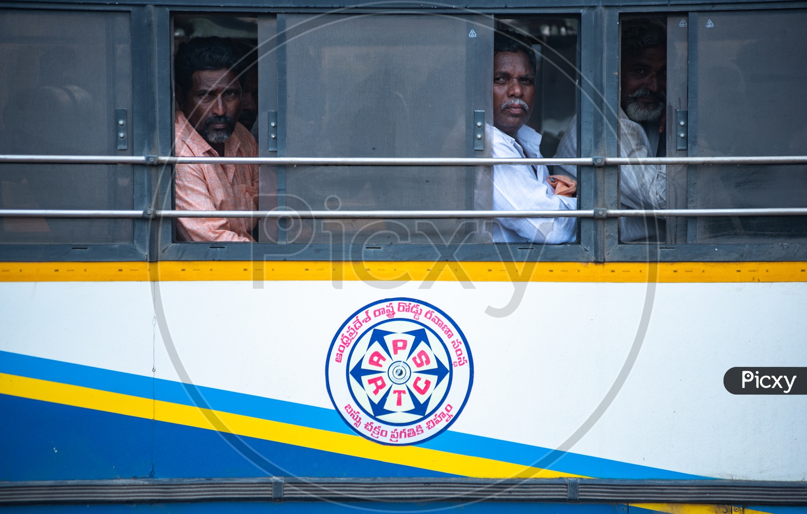 Passengers in an APSRTC Bus.