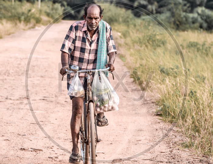 Old man cycling