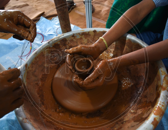A student tries his hand at Pottery