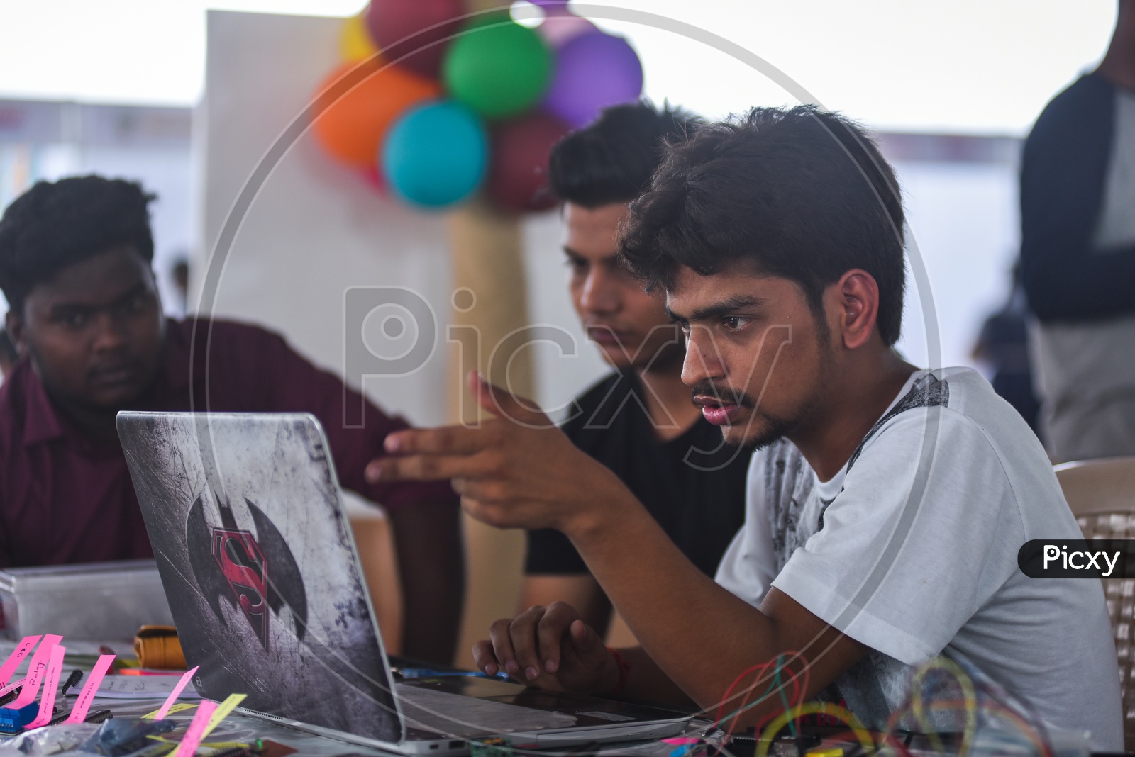 A student looking into a Laptop