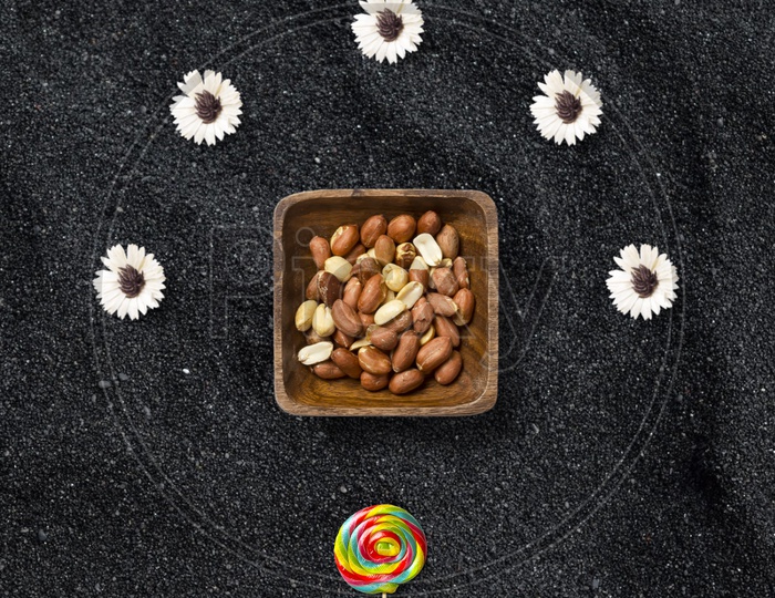 Flatlay peanuts with flowers