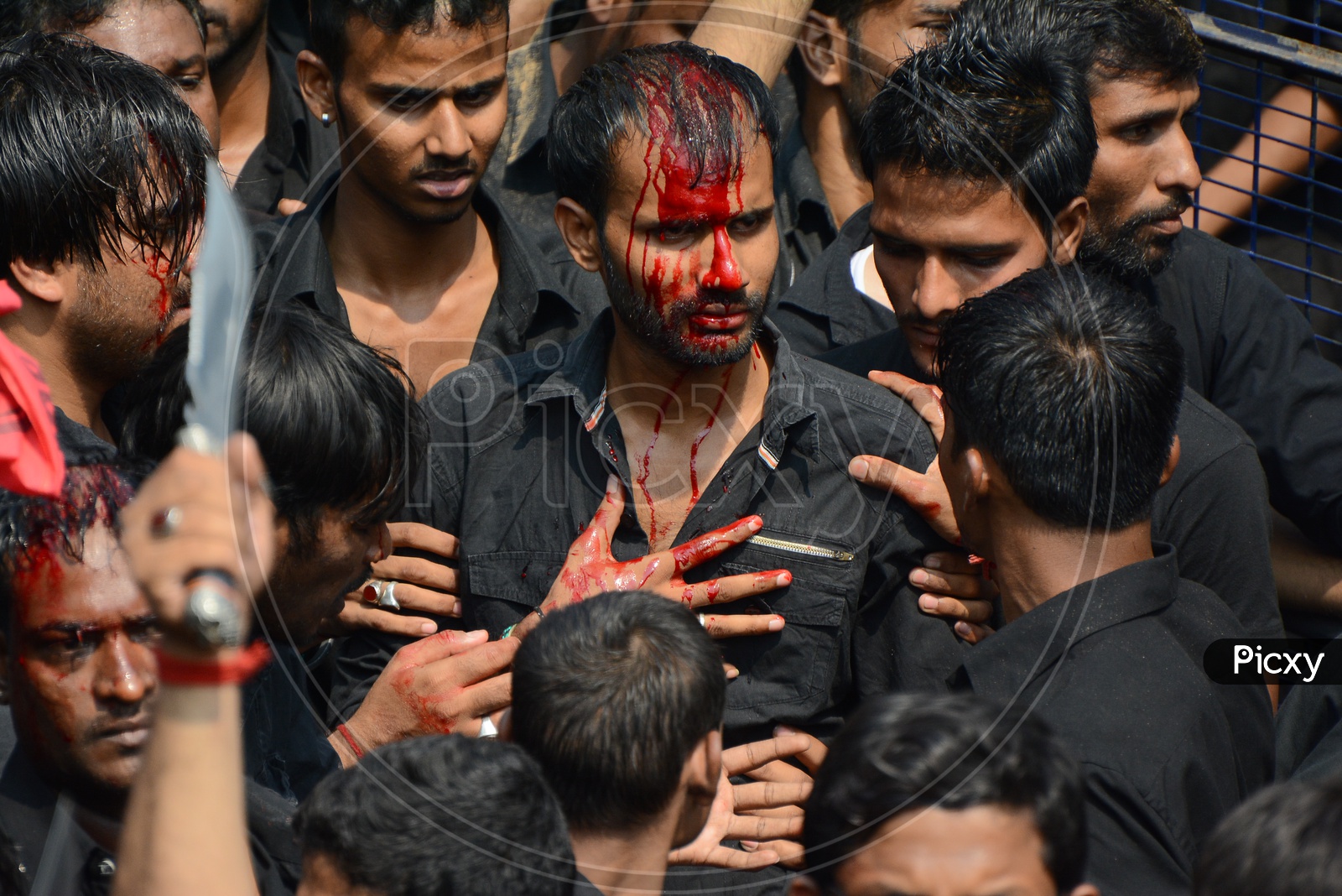 Muslims flagellate themselves in a procession to mark Ashoura during muharram