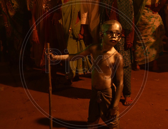 Kid in Gandhi attire at Sammakka Saralamma Jatara or Medaram Jatara
