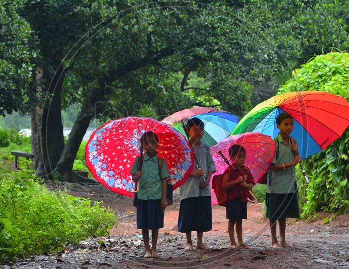 School Going Children with Umbrellas