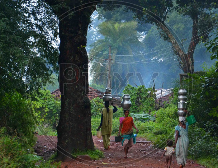 Rural Indian Women Carrying water on their head