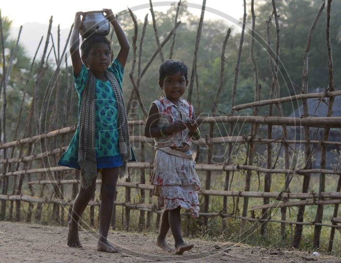 Tribal Children walking on road