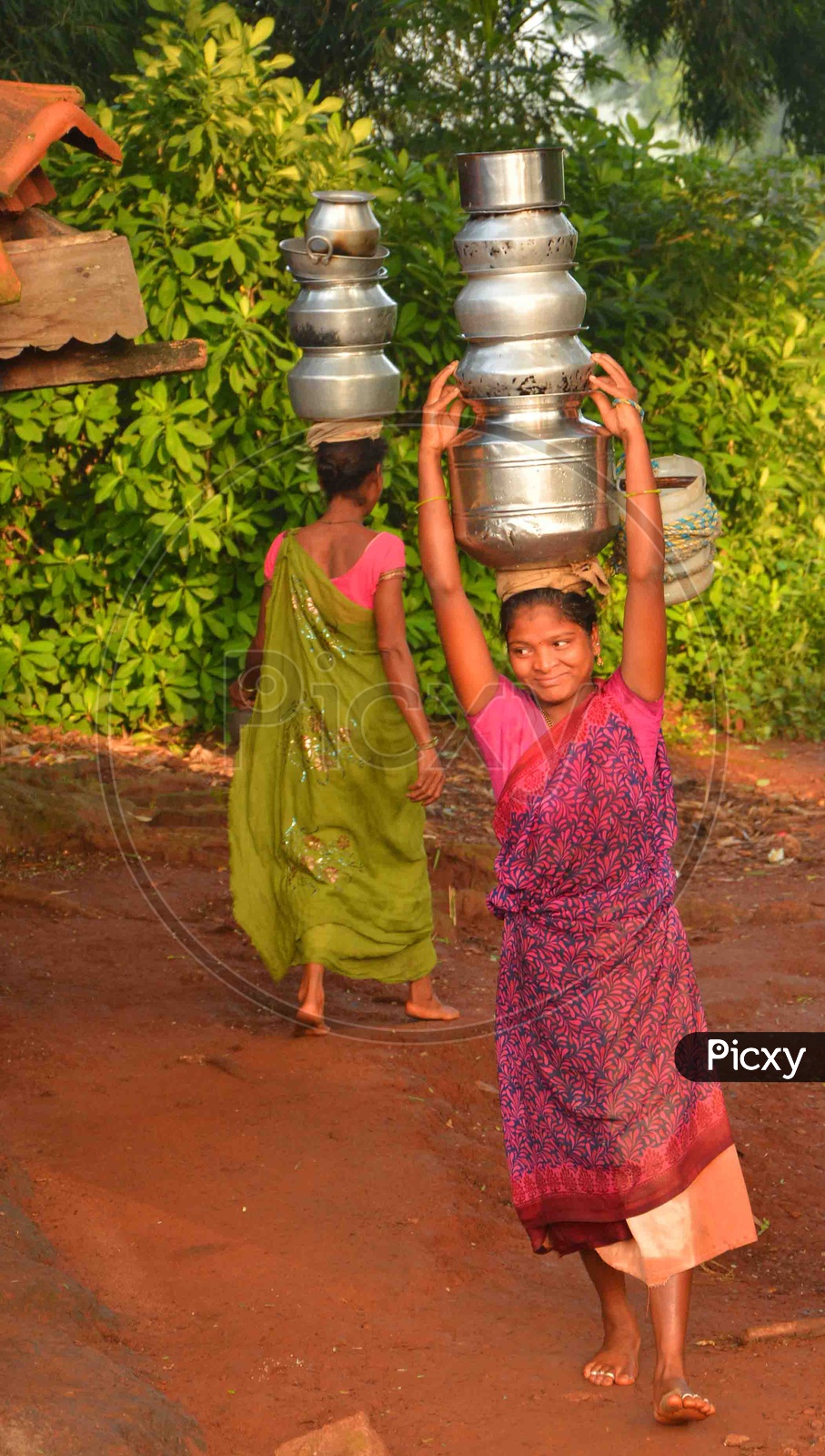 Tribal Women carry Water on their head