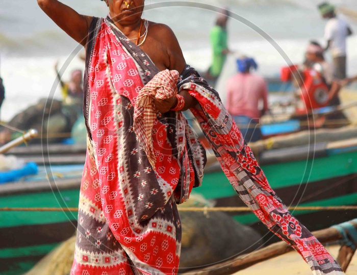 Woman near Fisherman Boats