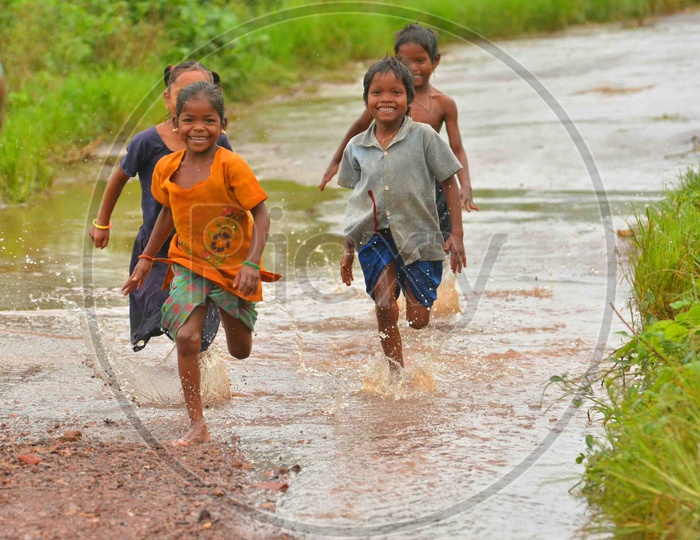 Tribal Children running on road