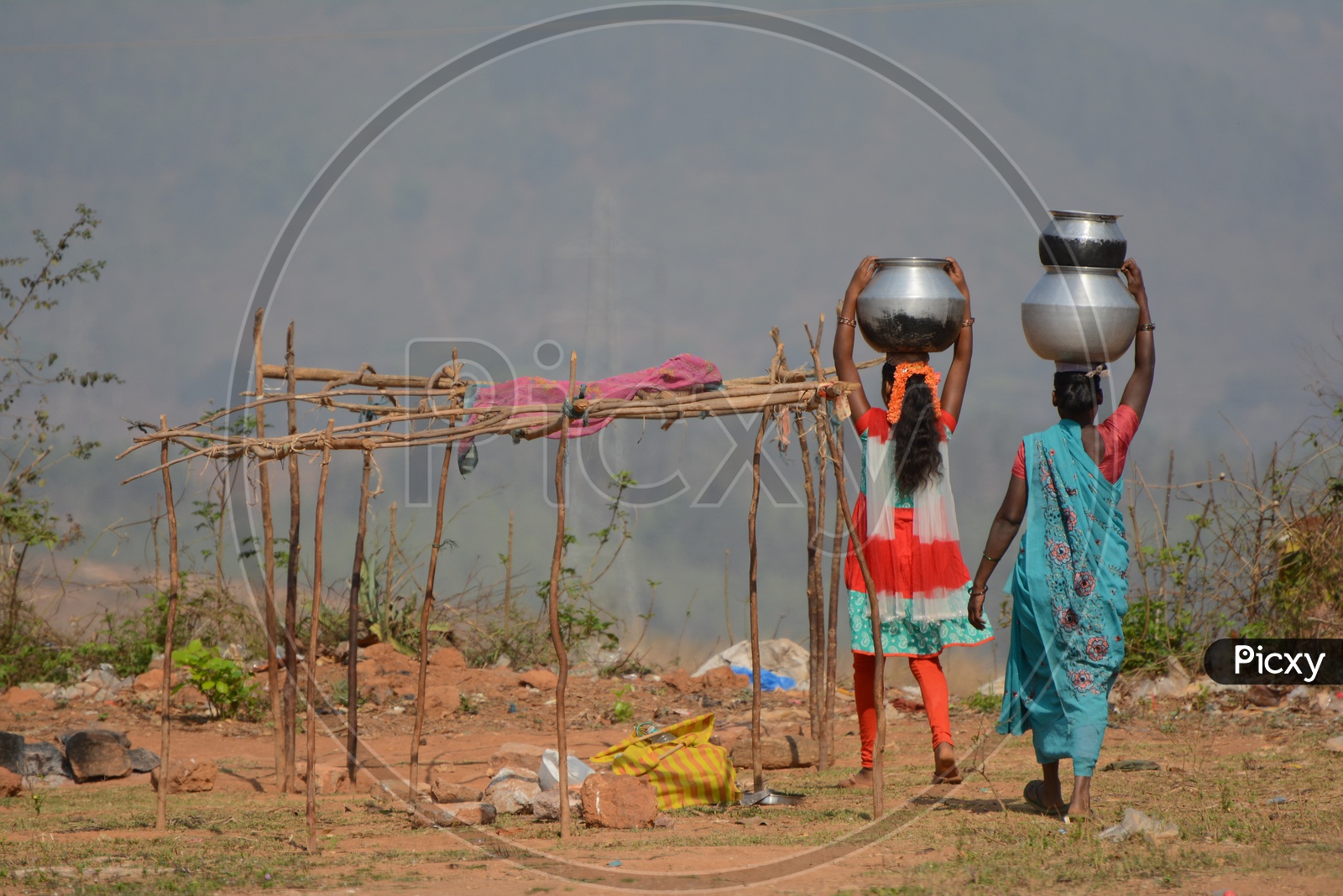 Tribal Women Carrying water on their Head