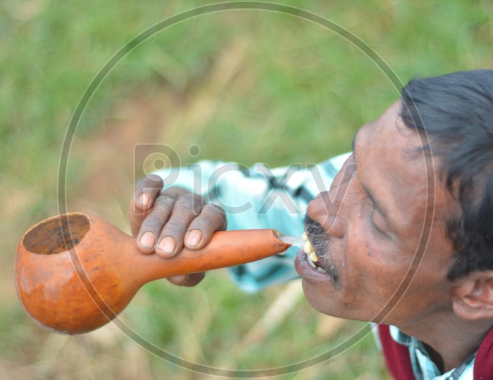Araku Tribal Man drinking Palm Wine