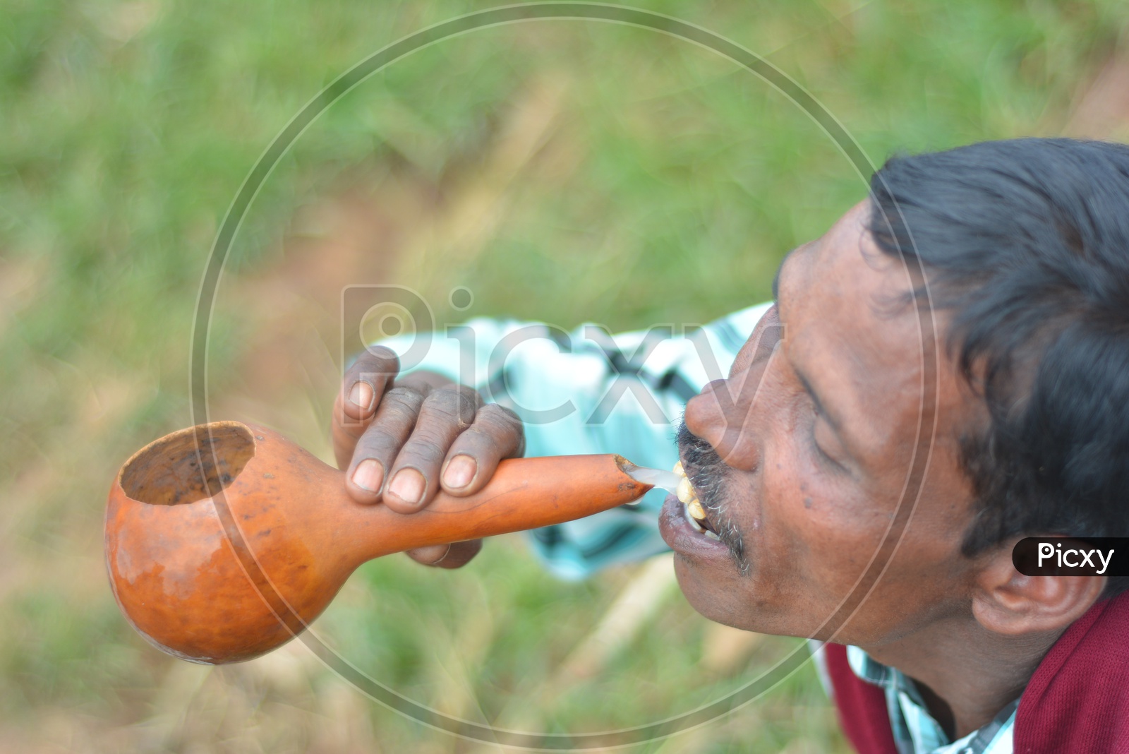 Araku Tribal Man drinking Palm Wine