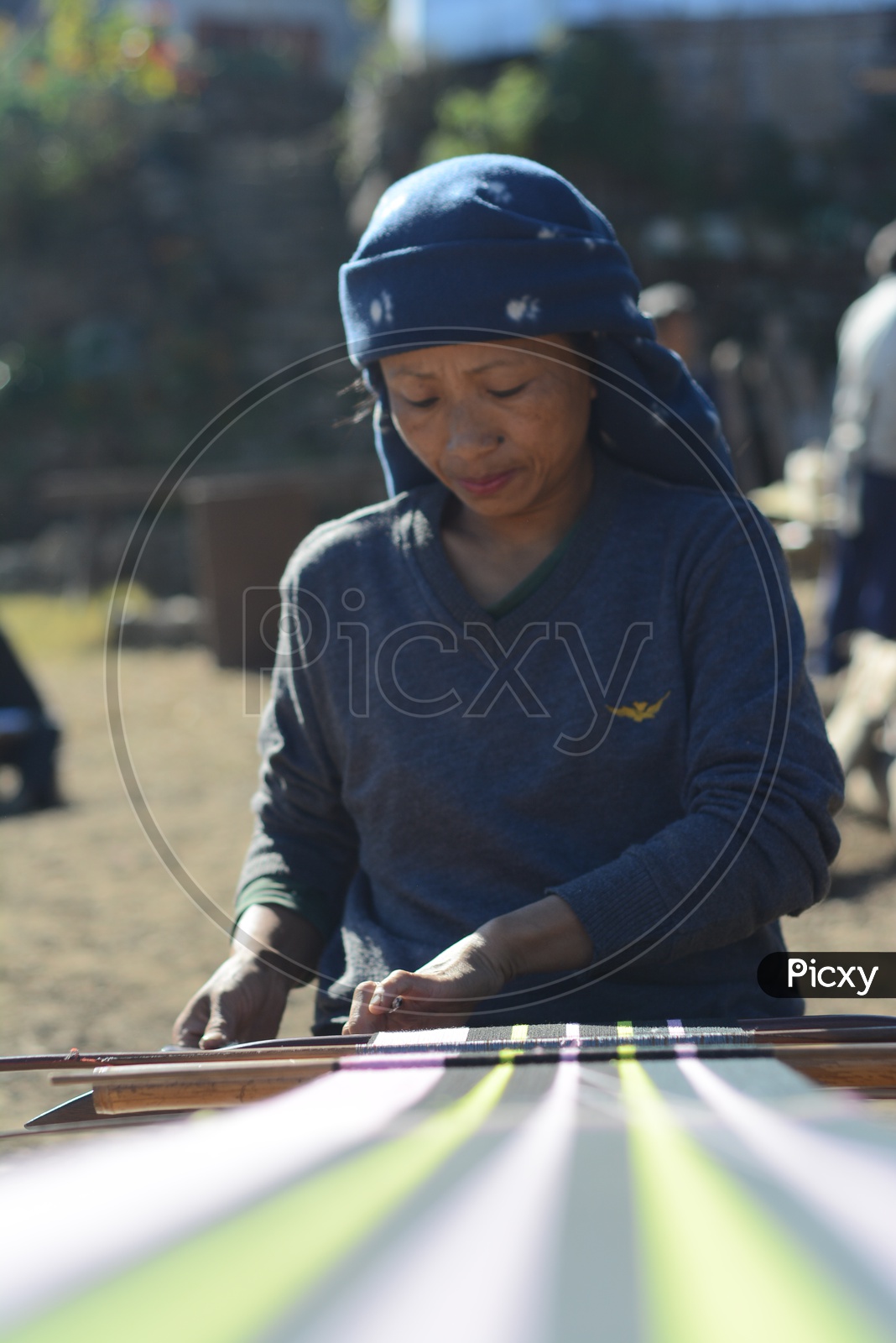Woman weaving a shawl in Nagaland